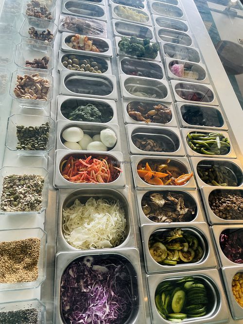 A wide variety of vegetables, seeds, and nuts to customize and add to your salad or rice bowl.  at Vegeta  in Tunis