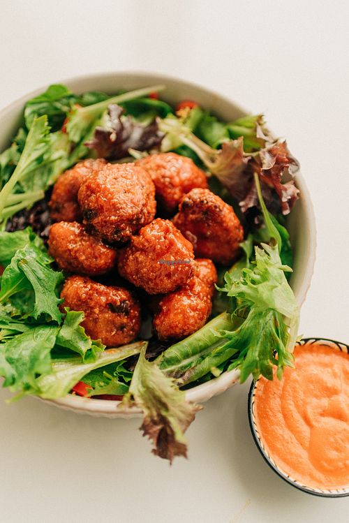 Crispy golden cauliflower florets tossed in a bold, tangy buffalo sauce. at Saatvik Cuisine Végé in Magog