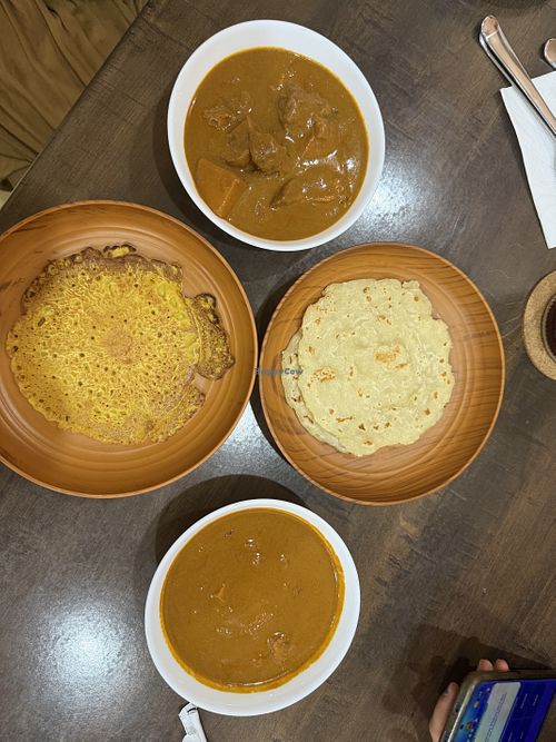 2x coconut flatbread with chicken curry (one flatbread is missing on the photo) and 1x Fried Egg  at Soul Vegan Café in Pulau Pinang