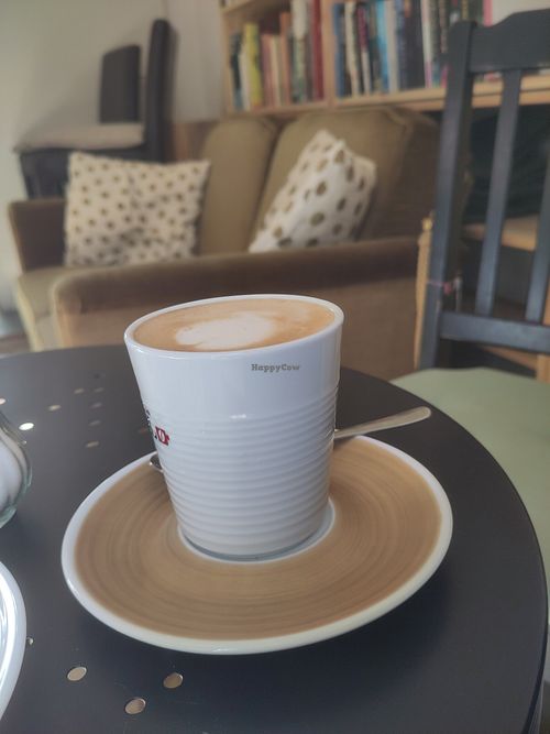 Decaf flat white in a cozy space at A Little West in Munich