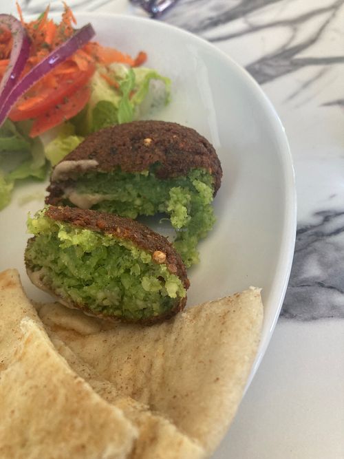 Ful Medames with pita bread and side salad included. Felafel ball was extra.  at Hummus Cafe in Seattle