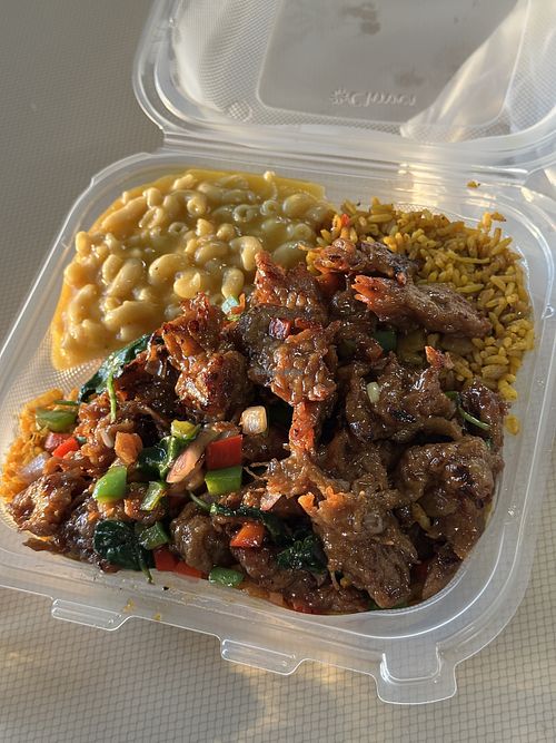 Vegan Citrus Short Ribs meal with Jollof Rice and Vegan Mac  at Anegada Delights Caribbean Cuisine in Columbia