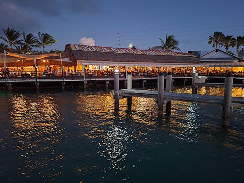 View of the restaurant at dusk. at The Island Fish Co. Restaurant & Tiki Bar in 