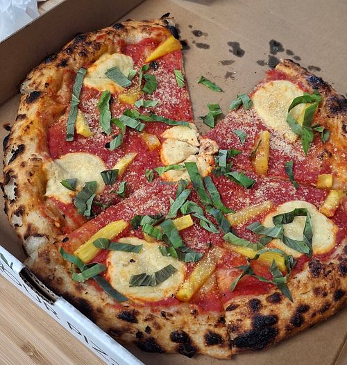 
VEGAN MARGHERITA - 
red sauce, cashew mozzarella, olive oil, vegan parmesan, fresh basil + added pineapple
 at Wild Flour Pizza Co in Abbotsford