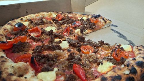 
VEGAN CALABRESE - 
red sauce, cashew mozzarella, house-seasoned Impossible sausage, peppadew peppers, caramelized onions, vegan parmesan
 at Wild Flour Pizza Co in Abbotsford