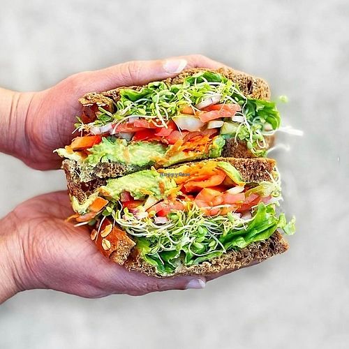 A garden sandwich on 9-grain bread piled high with avocado, sunflower seeds, sliced pickles, mushrooms, grated carrots, red bell pepper, onions, tomato, clover sprouts, lettuce and at Erik's DeliCafe in Mountain View