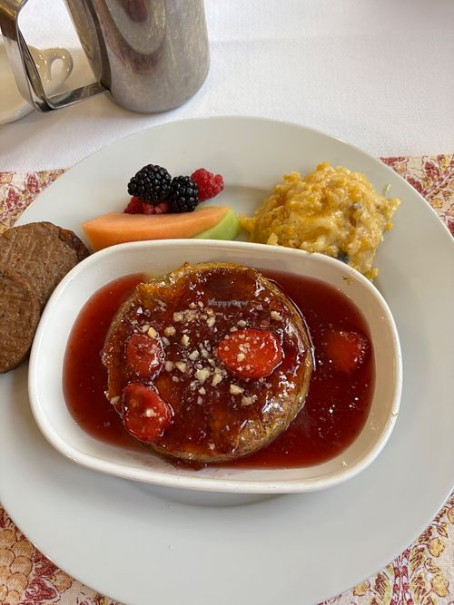 Completely vegan French toast with vegan sausage, potatoes and fruit. at Heartstone Inn Bed & Breakfast and Cottages in Eureka Springs