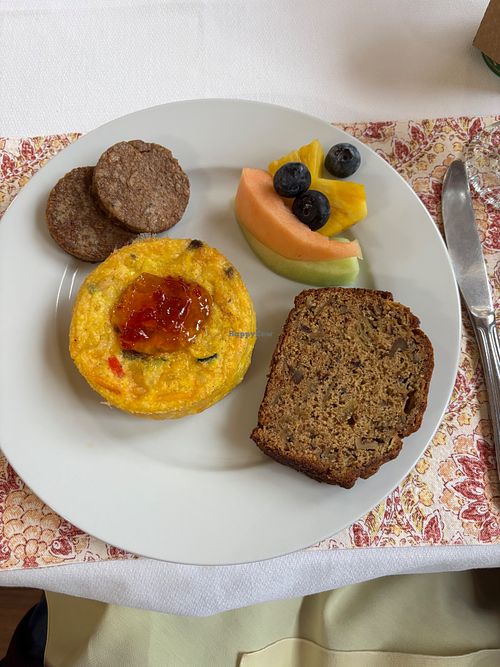 Completely vegan quiche with vegan sausage, apple bread, and fruit.  at Heartstone Inn Bed & Breakfast and Cottages in Eureka Springs