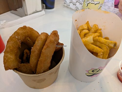Curly fries and onion rings, decent portion of fries, but onion rings were small for $7.50 at GBurger Wellington West in Ottawa