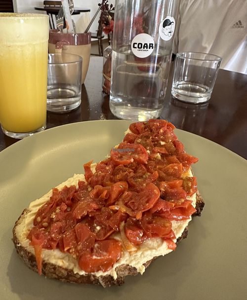 Humus toast with tomatoes, originally vegetarian but can be made vegan (without the eggs)  at coar cafeteria in Foz Do Iguacu