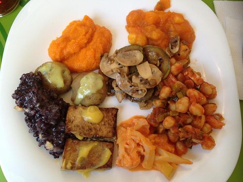 Some of the hot dishes options on a Sunday buffet: black rice risotto, tofu with green banana cream, grilled eggplant and zucchini with mushrooms, chickpeas with smoked tofu, palmito in squash, sweet potato dumpling.
 at Villa Natural in Santo Andre
