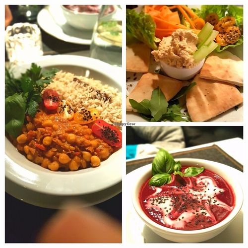 Beetroot soup, hummus with pita bread and chickpea stew with brown rice.  at Zielona Pracownia in Poznan