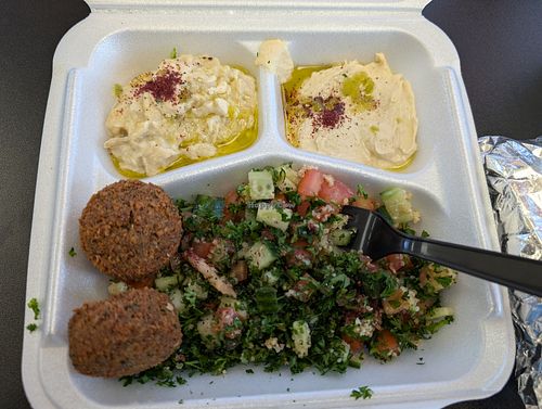Sampler plate with baba ganoush, hummus, falafel, and tabouleh at Tum Tums Mediterranean in Florence