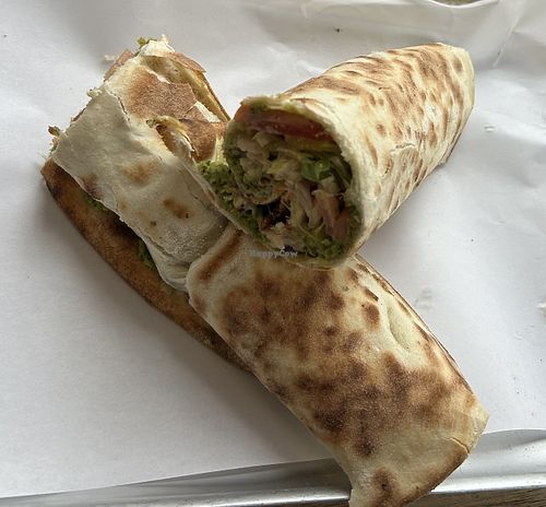 Inhouse made Falafel mix Baked on bread with Tomatoes, pickles, lettuce, tahini & Harrissa  at TA'MINI LEBANESE BAKERY in London
