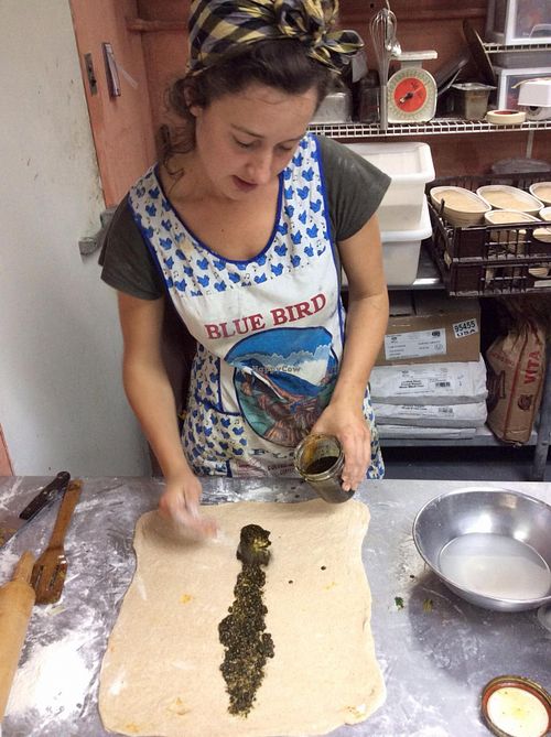 Meredith rolling out pastry dough at Community Loaves in Jacksonville