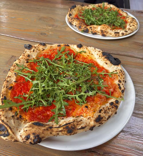 Pizza parmigiana with arugula, eggplant, olive oil and vegan cheese.  at Sotto Pizzeria Porvoo  in Porvoo