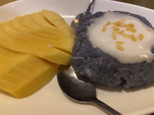 Mango sticky rice, make sure you ask for it without the whipped cream (coconut milk in pic)  at SabaiThai in Winchester