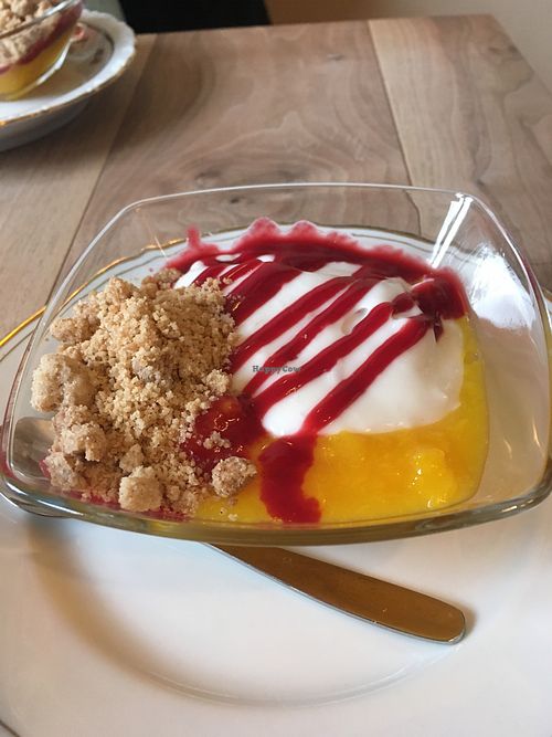 Peach Melba dessert, with raspberry and crumble at The Vegan Eagle in Hamburg