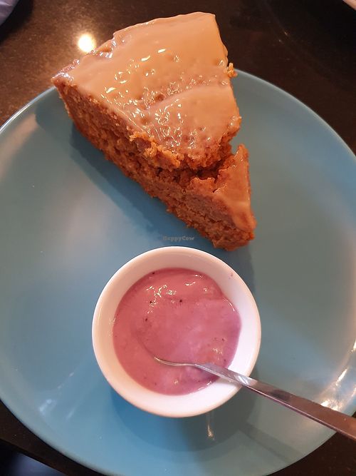 The wonderful carrot caramel cake!!! With some red fruits yoghurt!!! ❤️🥰😍 at Nirvana Cafe in Luxembourg City