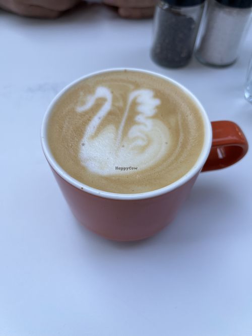 Oat milk latte  at Calico Café  in Lille