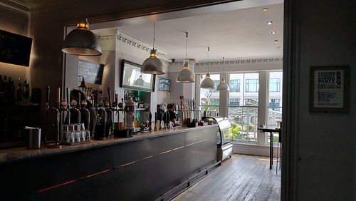 Order at the bar, they'll bring the food to you at Kro Bar  in Manchester