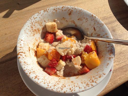 Breakfast with fresh fruit, oat flakes and cinnamon at Wild Beets in Ibiza