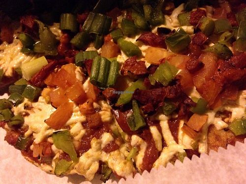 Gluten free vegan pizza with Daiya cheese, red, green and jalapeño peppers and some scallions at Custom Fuel Pizza in Washington