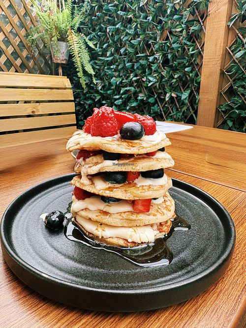 Vegan pancake stack with Greek style yoghurt, fresh berries & maple syrup - incredible!  at Beans N' Brunch in Tring