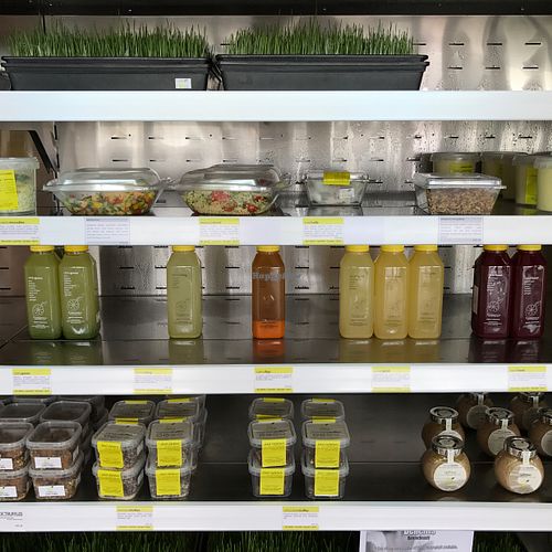 prepackaged food and juices in the cooler at The Raw Place - Al Muneera in Abu Dhabi