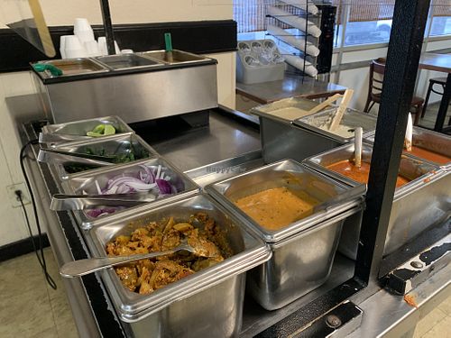 Sauce, condiments and soup station. at Taj Chaat House in Irving