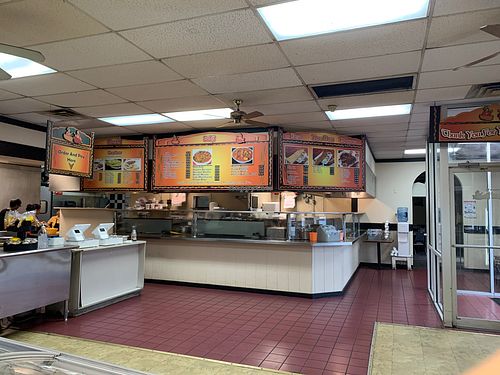 Part of the cooking stations and register. at Taj Chaat House in Irving