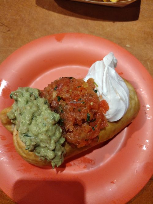 Sauteed veggie chimichanga with vegan cheese, vegan sour cream, and guacamole at Burrito Perdido in Chesapeake