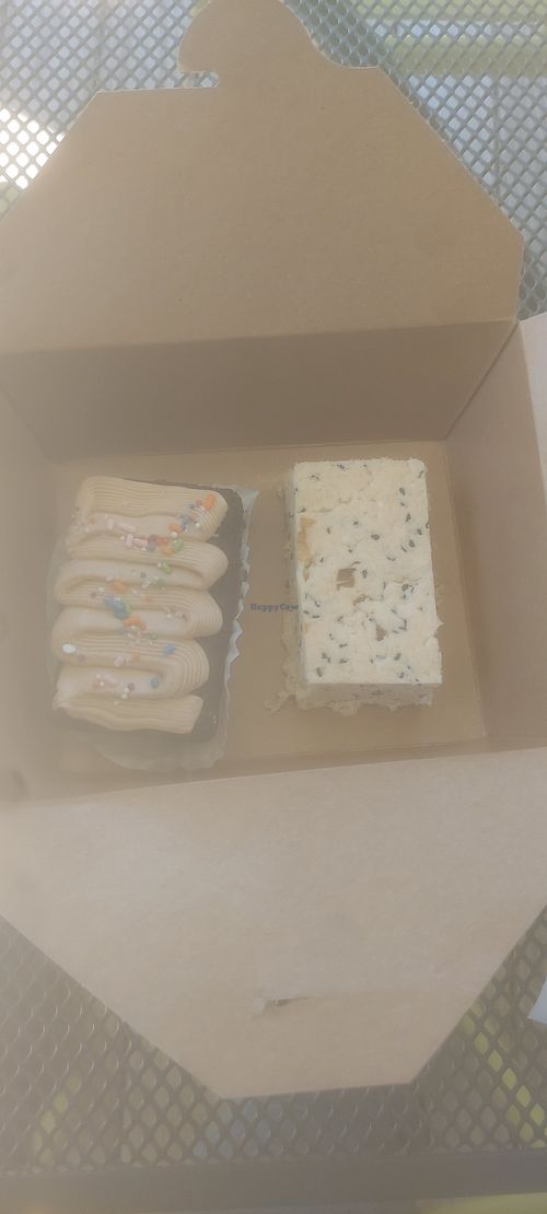 Vegan chocolate cake on the left. Vegan green onion/sesame savory bar on the right. at Little Loaf Bakehouse in Yorkville