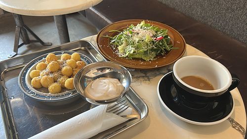 Caesar salad and some potatoes with vegan parmesan  at Pilkku in Helsinki
