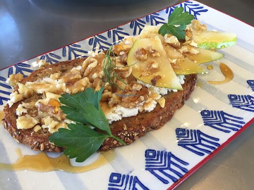 Multigrain toast with pear, Kite Hill ricotta, walnuts, maple drizzle at EAT Marketplace in Temecula