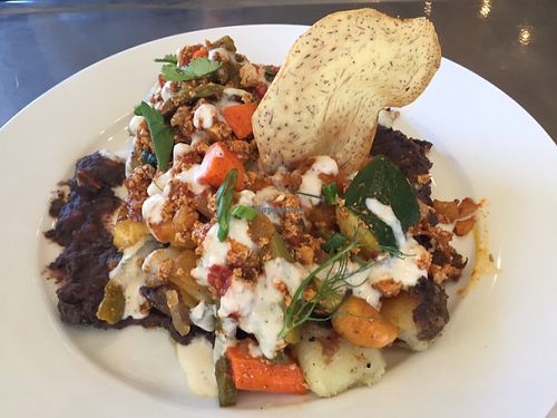 vegan huevos with plant-based chorizo over black bean purée, breakfast potatoes, tomato & nopales, cashew crema  at EAT Marketplace in Temecula