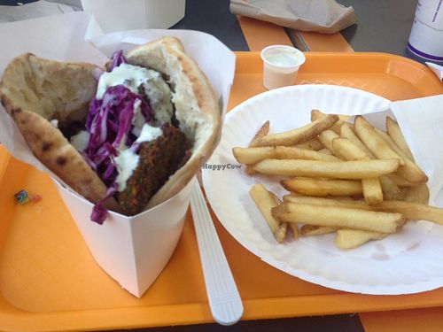 Whole falafel sandwich  with tahini and fries at Maoz Vegetarian in Orlando