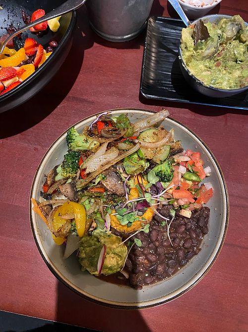 Burrito bowl, side order of guac, remnants of tropico salad at Bandoleros Mexican Grill in Concord