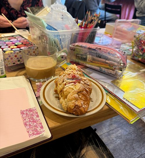 Raspberry croissant and oat latte  at Bee May Bakery in Brighton
