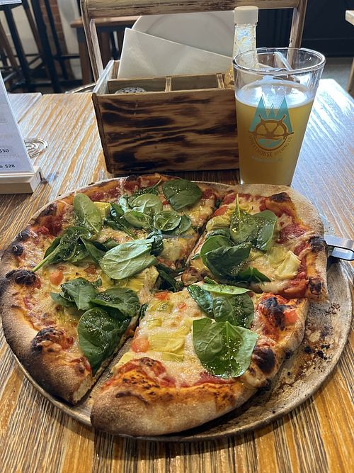 You can request a non-dairy pizza. It had artichoke hearts and fresh basil. Very tasty !  at Wheelhouse Brewing Company in Prince Rupert