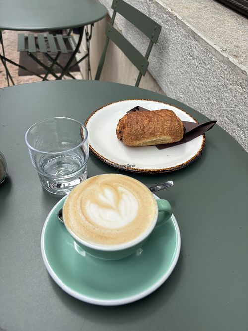Oat milk cappuccino and vegan pain au chocolate   at FolkLore Specialty Coffee and drinks in Feltre