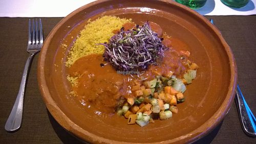 Vegan tajin: saffron couscous, falafel, vegetables and spicy tomato sauce at Cammerlander Market Bar in Innsbruck