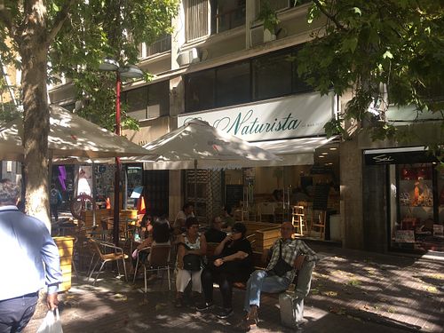 Outdoor seating on pedestrian street at El Naturista - Huerfanos in Santiago
