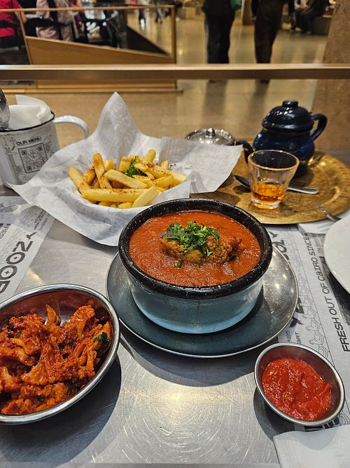 Moussaka (middle) corliflour mezze (left) and amazing fries at Zooba in Giza