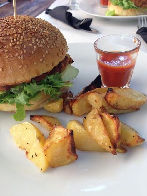 Gorgeous vegan burger, baked potato chips and delicious homemade tomato sauce at Rendez Vous Ristorante. at Rendez Vous Ristorante in Rome