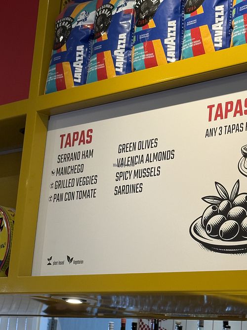 Vegan tapas labeled  at AMS - Cafe Comunal in Schiphol