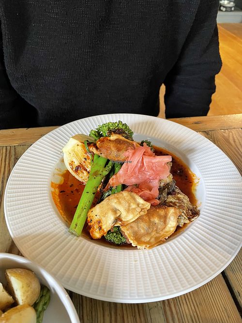 Crispy gyozas, teriyaki Chinese cabbage, charred Tenderstem®, miso aubergine, Gochujang dressing  at The Red Lion in Cambridge
