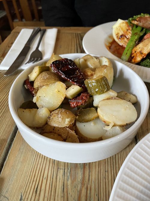 Warm new potato salad, smashed cucumbers, sun-dried tomatoes, asparagus  at The Red Lion in Cambridge