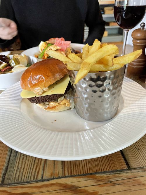 Symplicity plant-based cheeseburger, smokey pickles, signature sauce, fries  at The Red Lion in Cambridge