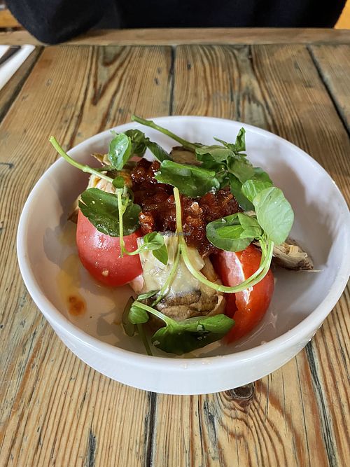 Heritage tomatoes, pickled Crematta, charred artichokes, peppers  at The Red Lion in Cambridge